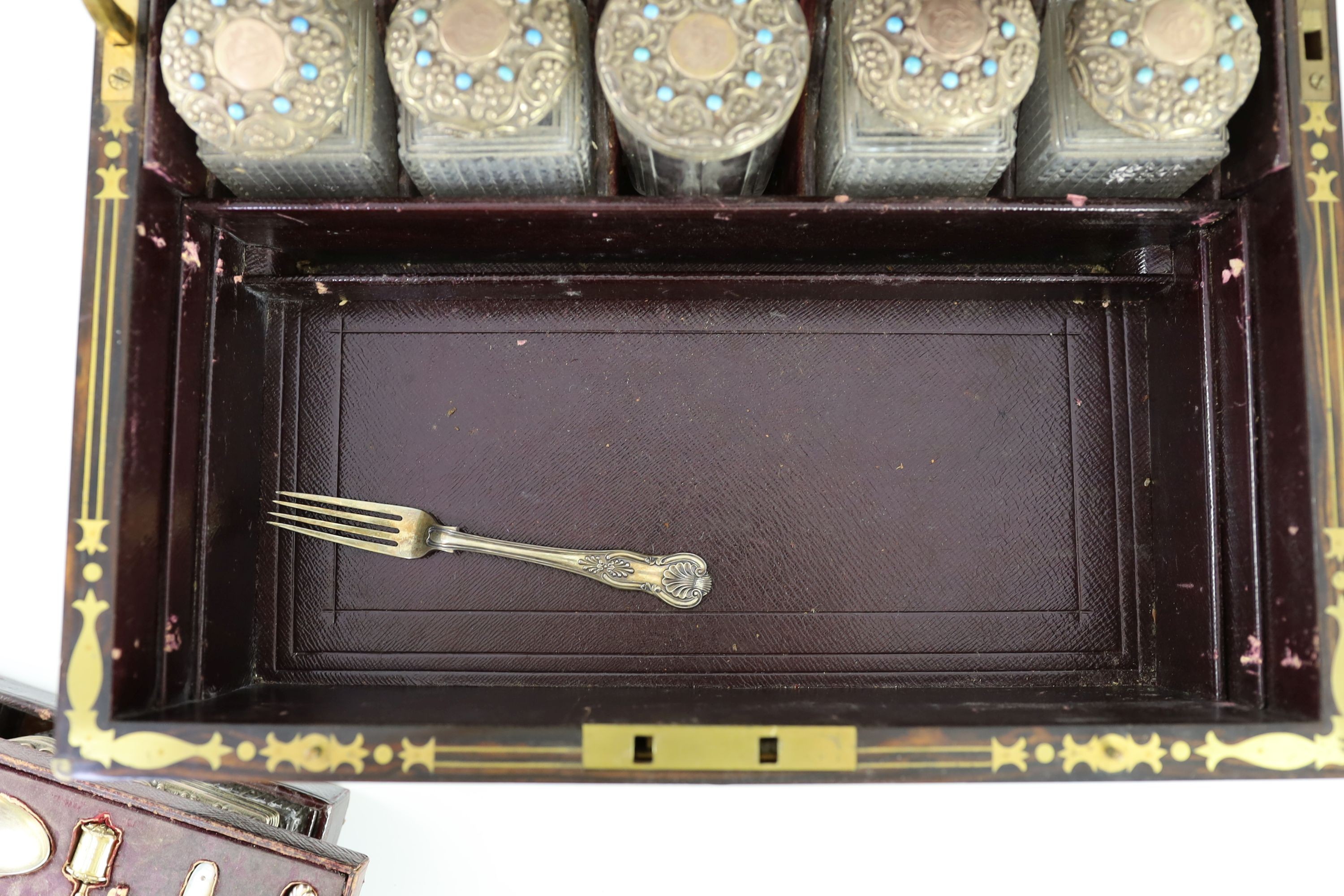 A good Victorian brass mounted and brass monogrammed coromandel travelling toilet set, containing fifteen silver gilt and turquoise bead mounted glass jars and bottles, by Hallstaff & Hannaford